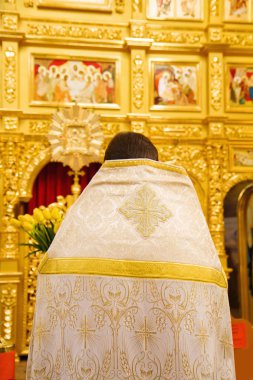 Close up of orthodoxal priest in church clipart