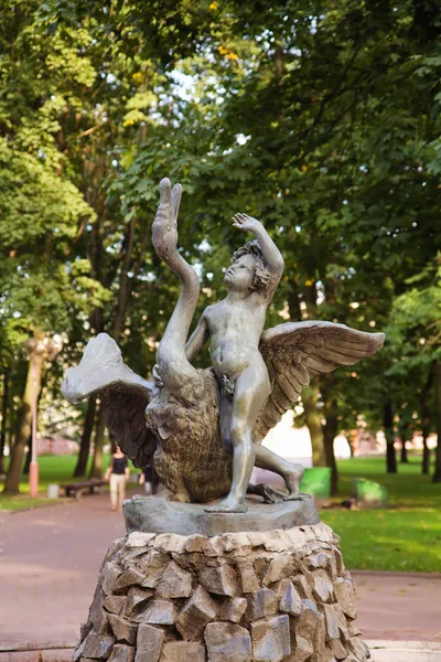 Boy and swan statue in park, Minsk. Belarus. — Stock Photo, Image