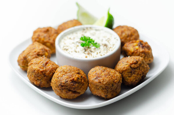 Falafels, gently spiced blend of sweet potato, chickpeas and onion with a sour dip, middle eastern food