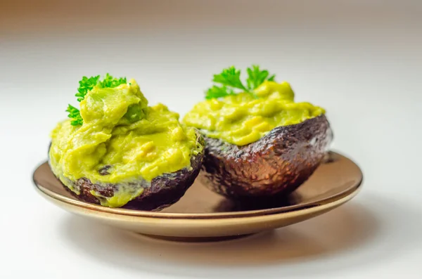 Smashed avocado,  smother avocado with lemon juice served on the for brunch, organic food