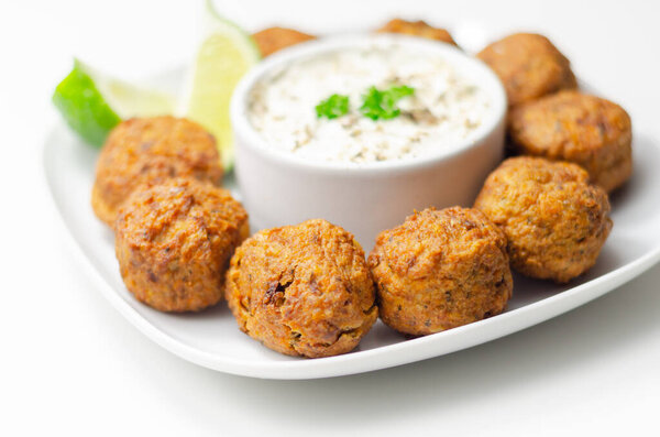 Falafels, gently spiced blend of sweet potato, chickpeas and onion with a sour dip, middle eastern food