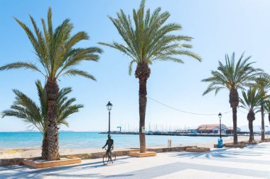 LOS ALCAZARES, SPAIN - 25 FEBRUARY 2019 The city of Los Alcazares was a holiday resort chosen by a popular actor for over 50 years, a posthumous sculpture was dedicated to him, which depicts him in a typical picture, on a bicycle and in a hat