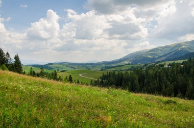 Mountain landscape. countryside landscape. beautiful views of the mountains in the summer. green trees and beautiful cloudy sky.