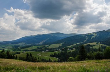 Mountain landscape. countryside landscape. beautiful views of the mountains in the summer. green trees and beautiful cloudy sky.