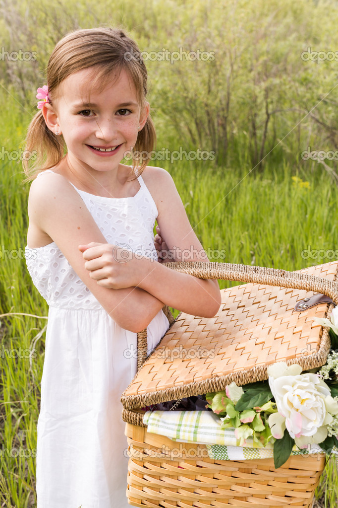 Cute girl with picnic basket Stock Photo by ©urban_light 47979293