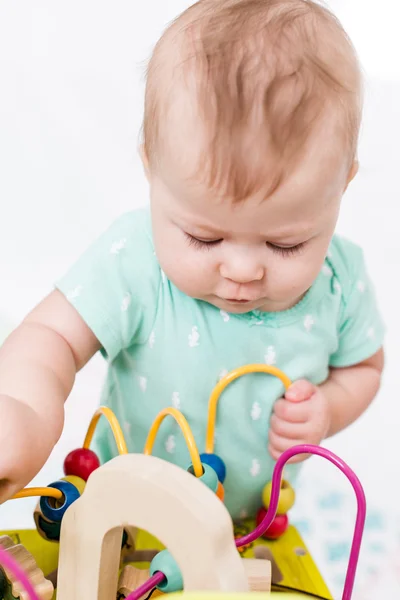 Cute baby girl with toys — Stock Photo, Image