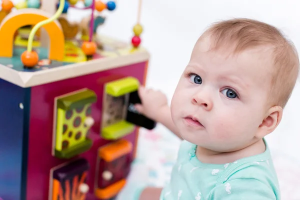 Cute baby girl with toys — Stock Photo, Image