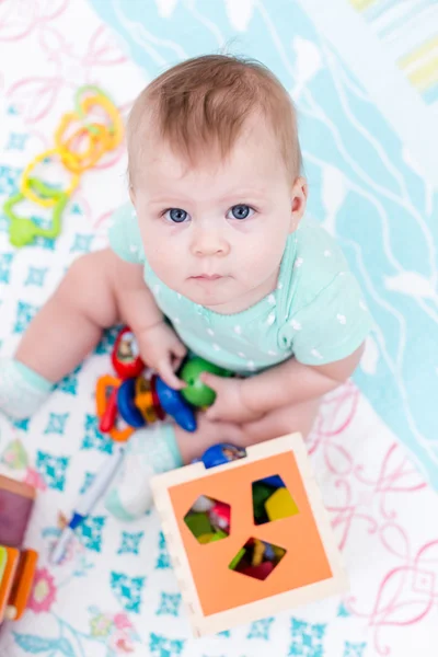 Cute baby girl with toys — Stock Photo, Image