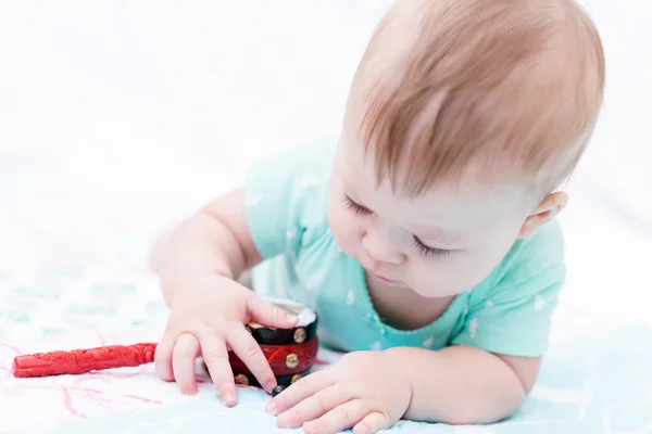 Cute baby girl with toys — Stock Photo, Image