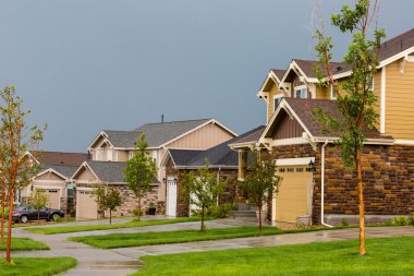 Suburban community with model homes. clipart