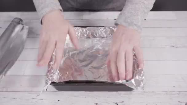 Lining Baking Pan Cooking Foil Make Homemade Fudge — Stock Video