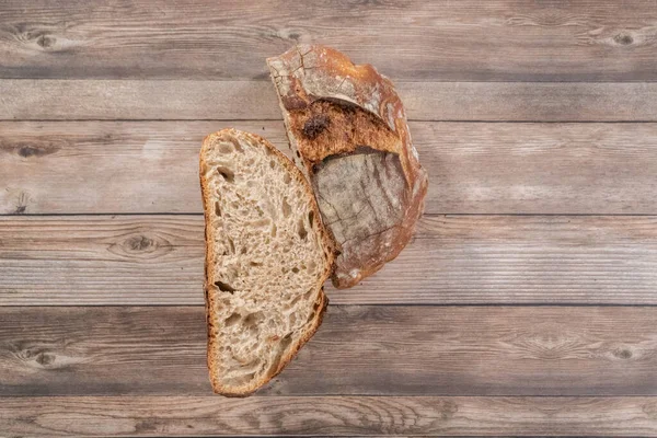 Flat lay. Sliced baked sourdough rye loaf of bread.