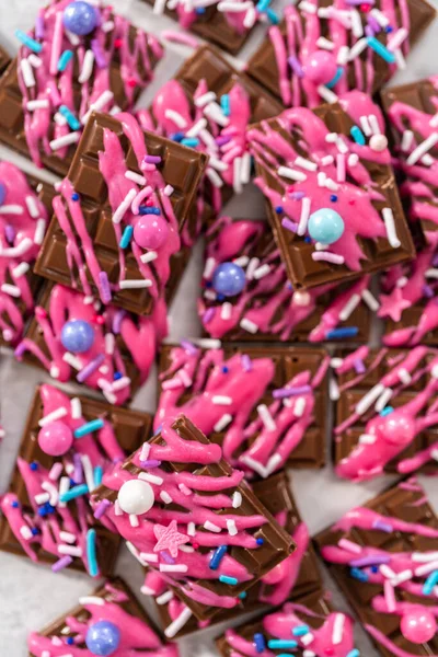 Gourmet Dark Mini Chocolates Drizzled Pink Chocolate Fancy Sprinkles Top — Stock Photo, Image
