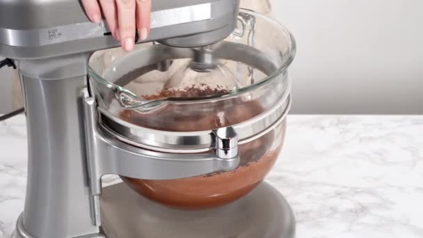 Making Chocolate Ganache Frosting Top Chocolate Cupcakes — Stock Video