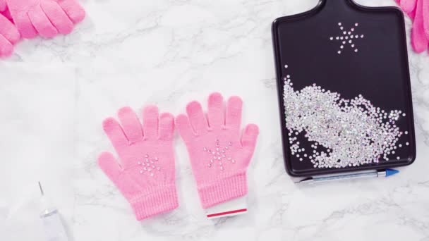 Flat Lay Rhinestone Pink Kids Gloves Snowflake Shapes — Stock Video
