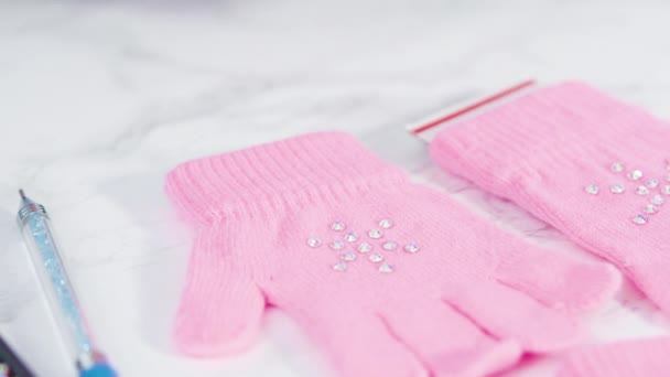Flat Lay Rhinestone Pink Kids Gloves Snowflake Shapes — Stock Video