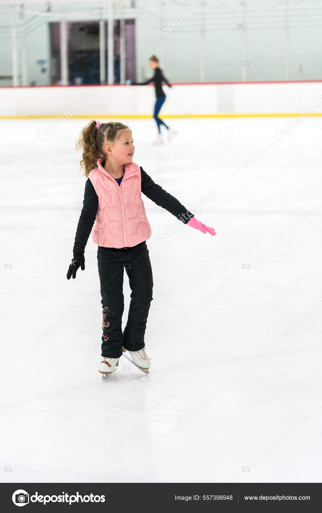 Little Girl Practicing Figure Skating Elements Indoor Ice Skating Rink