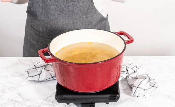 Boiling Pasta Enameled Dutch Oven Prepare Chicken Alfredo Pasta — Stock Photo, Image