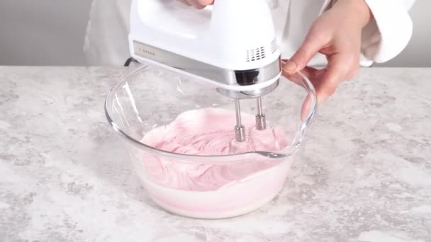 Making Cream Funfetti Bunt Cake Pink Buttercream Icing — Stock Video