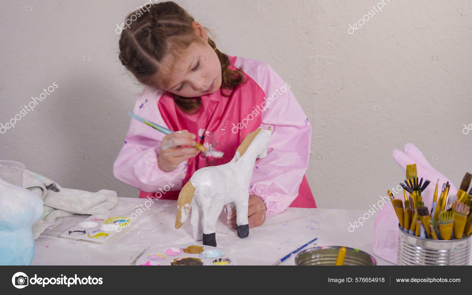 Little Girl Painting Paper Mache Figurine Homeschooling Art Class Stock Photo by ©urban_light