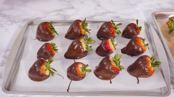 Step by step. Garnishing chocolate dipped strawberries with drizzled chocolate.