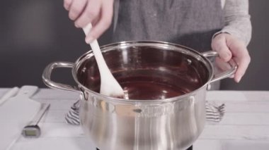 Mixing ingredients to make simple chocolate fudge