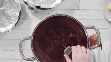 Mixing ingredients to make simple chocolate fudge