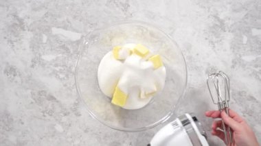Making cake batter to bake a red velvet bundt cake.