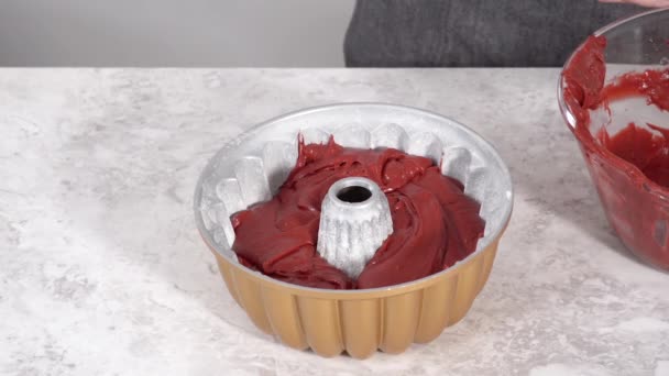 Making Cake Batter Bake Red Velvet Bundt Cake — Stockvideo