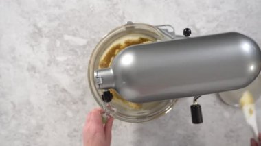 Making cake batter to bake a red velvet bundt cake.