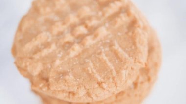 Making peanut butter cookies.