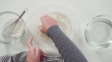 making bread dough to prepare homemade flatbread.