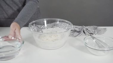 making bread dough to prepare homemade flatbread.