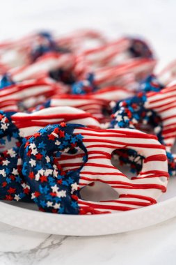American flag. Red, white, and blue chocolate-covered pretzel twists.