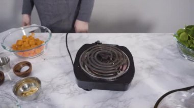 Time lapse. Cooking vegetarian white bean soup in cast iron dutch oven.