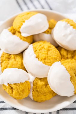 Lemon Cookies with White Chocolate. Freshly baked lemon cookies with white chocolate on a white ceramic plate.