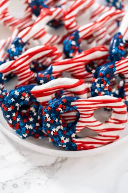 American flag. Red, white, and blue chocolate-covered pretzel twists.