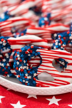 American flag. Red, white, and blue chocolate-covered pretzel twists.