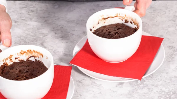 Step by step. Chocolate mug cakes garnished with whipped cream and chocolate hearts and lips.