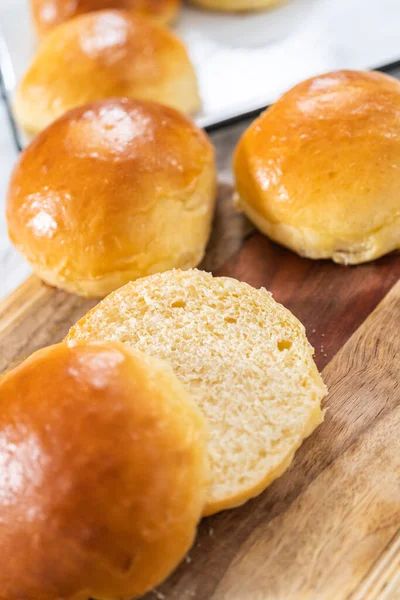 Slicing Freshly Baked Brioche Bun Wood Cutting Board — Stock Photo, Image