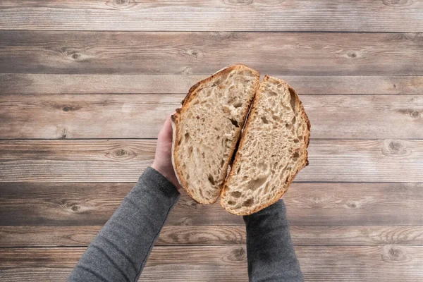 Flat lay. Sliced baked sourdough rye loaf of bread.