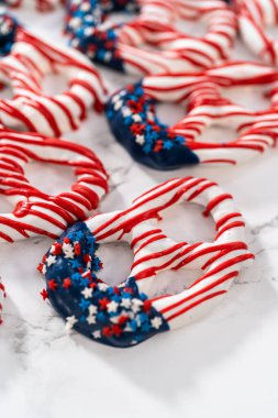 American flag. Red, white, and blue chocolate-covered pretzel twists.