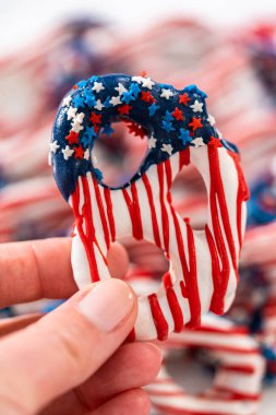 American flag. Red, white, and blue chocolate-covered pretzel twists.