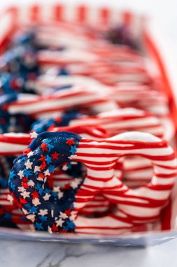 American flag. Red, white, and blue chocolate-covered pretzel twists.