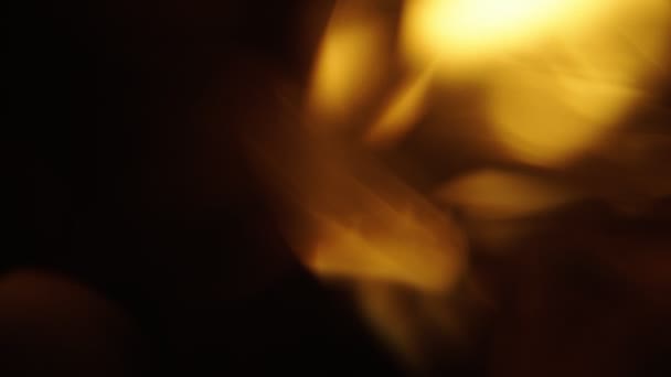 Żółte światło abstrakcyjne tło bokeh kinematyczna tapeta. Czarne tło — Wideo stockowe