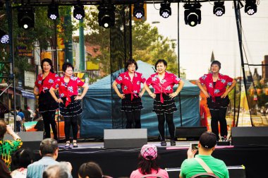Toronto, Canada - 08 19 2018: Traditional Chinese dance performers on the main stage of the 18th Toronto Chinatown Festival