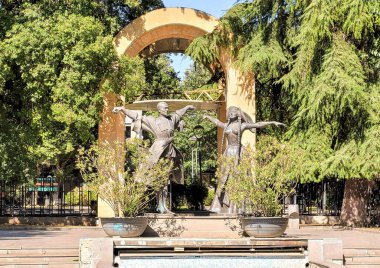 Tbilisi, Georgia - 07 23 2022: The statues of the founders of the Georgian National Ballet Iliko Sukhishvili and his wife Nino Ramishvili by Zurab Tseretelican are placed at the entrance to the Jansug