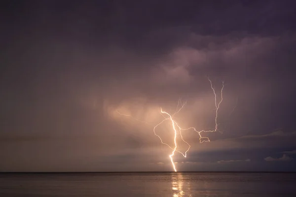 Lightning over the sea at night in the south Photo De Stock