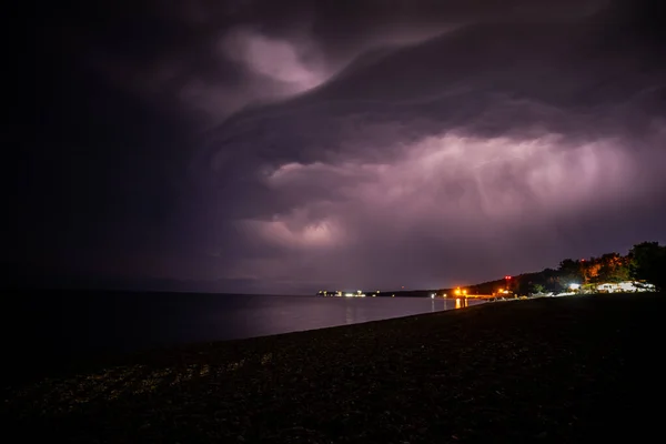 Lightning over the sea at night in the south Image En Vente