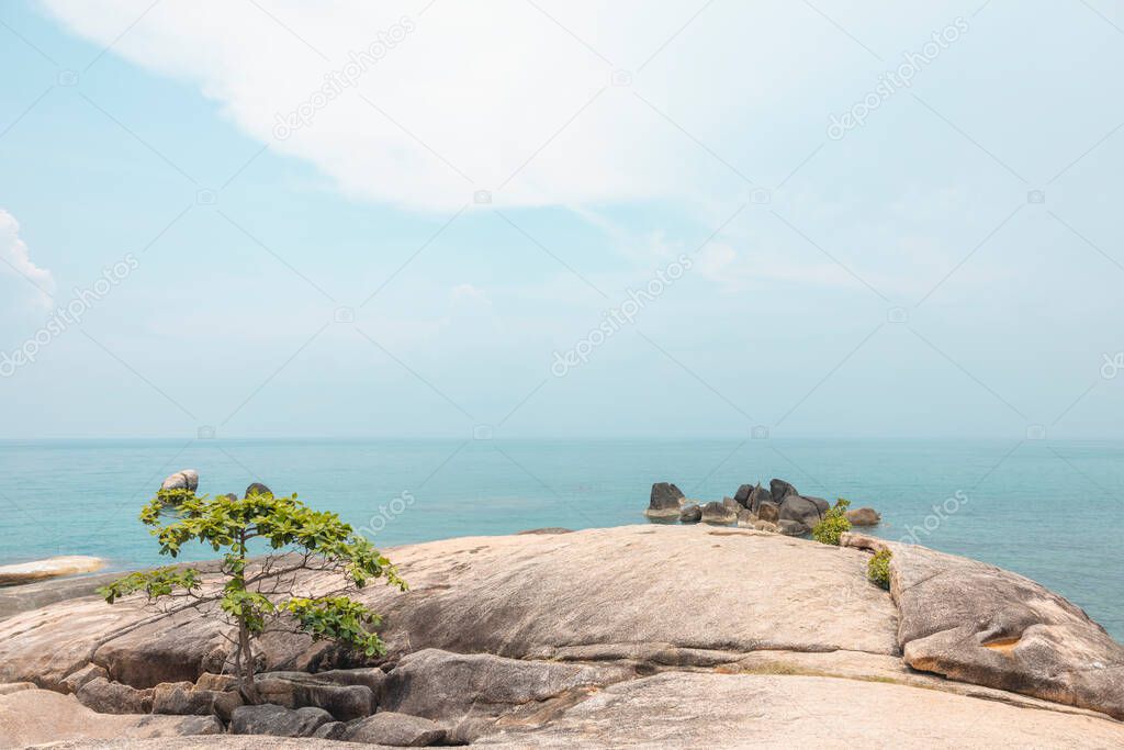 Sea landscape with rocks in the foreground and sky in the background. Therapeutic natural scenery gives a feeling of relaxation. At Koh Samui, Surat Thani Province, Thailand.